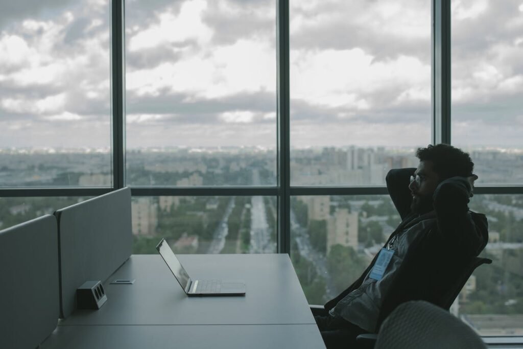 sitting at a desk in thought