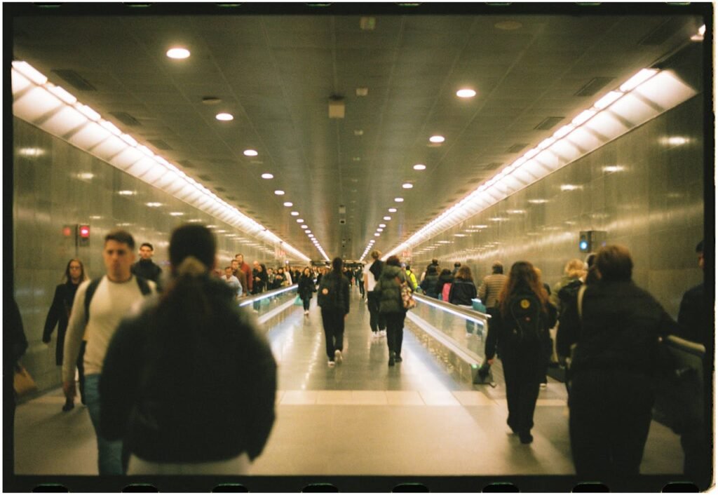 A person pausing in a busy city