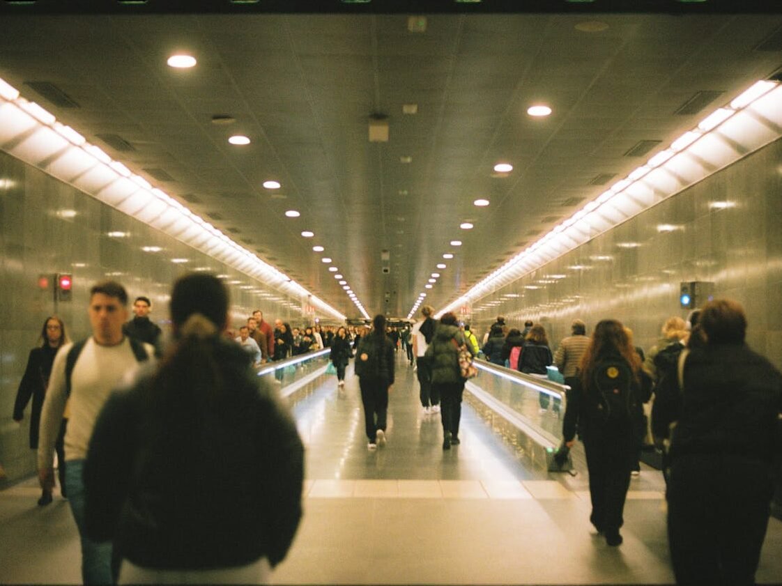 A person pausing in a busy city