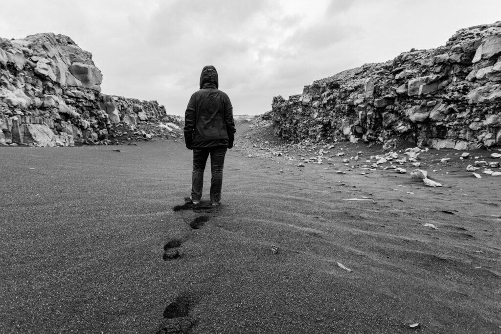 A person walking calmly on their own path while other paths appear in the distance