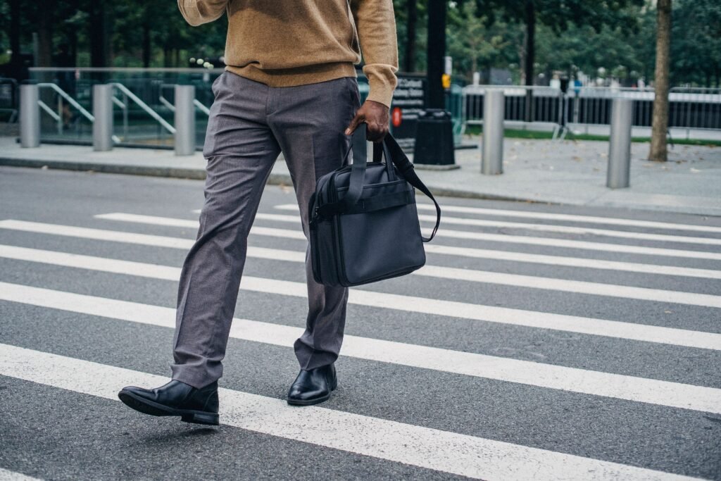 A professional standing at a crossroads or looking toward a new path