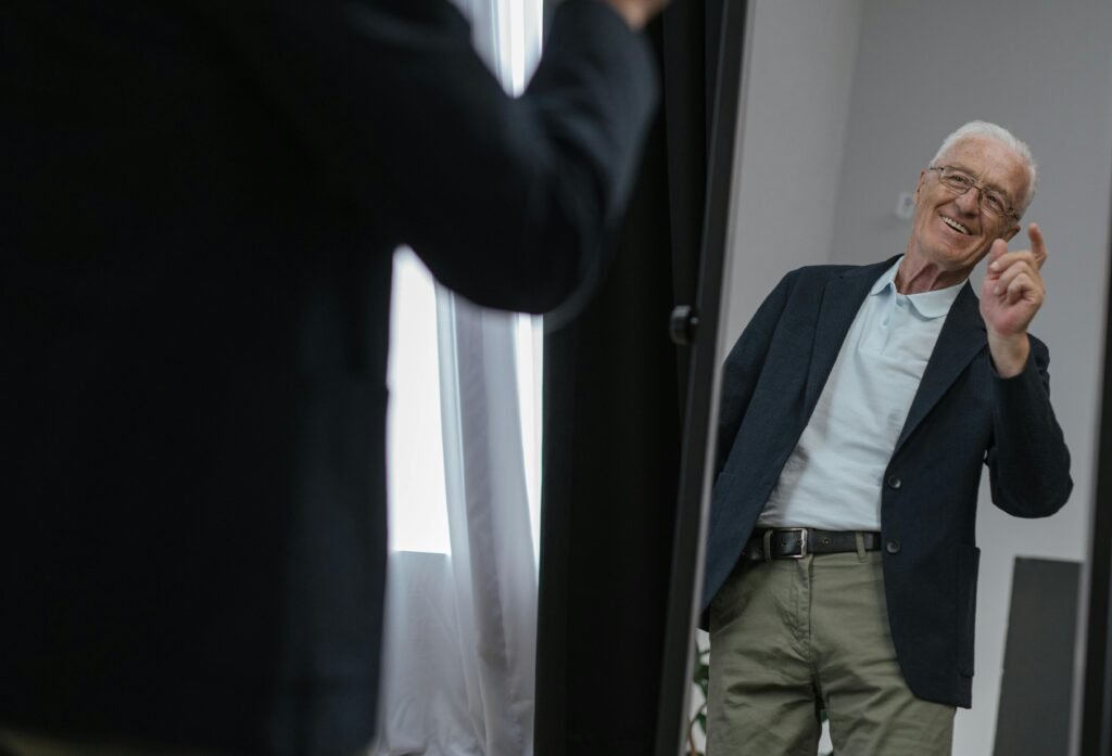 A person standing confidently in front of a mirror with a calm expression